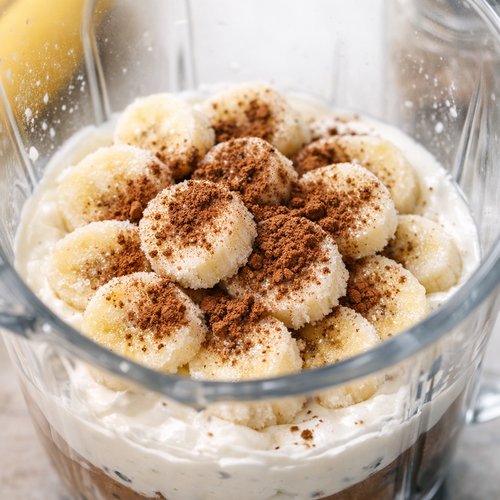 Step 3: Add Your Frozen Bananas and Cocoa Powder